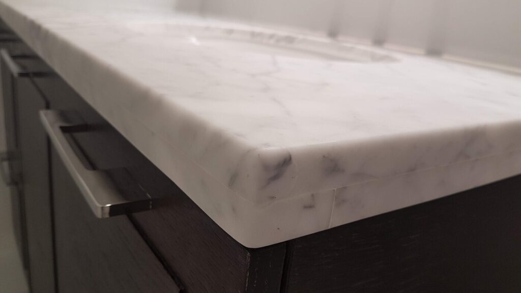 The same marble corner after repair, filled and polished flush